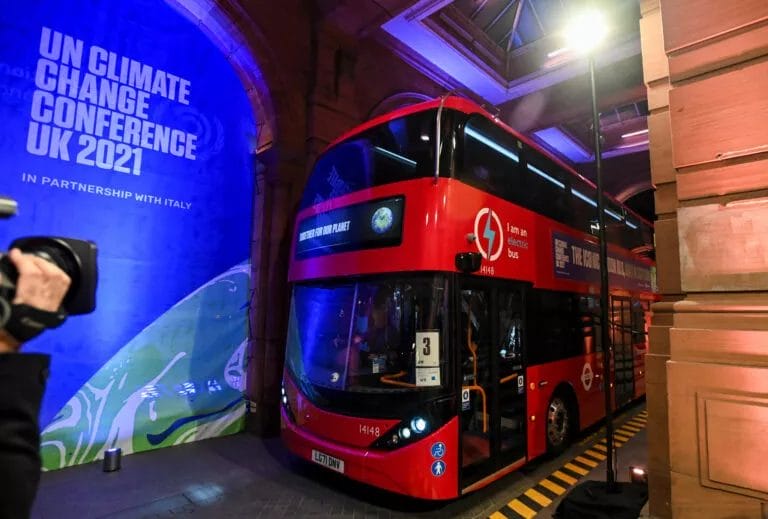 A London red bus drops Prime Minister Boris Johnson at a COP26 reception at the Kelvingrove Art Gallery, Glasgow